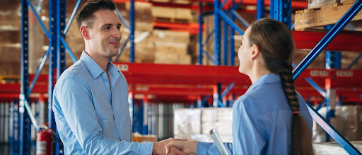 trades professionals shaking hands.