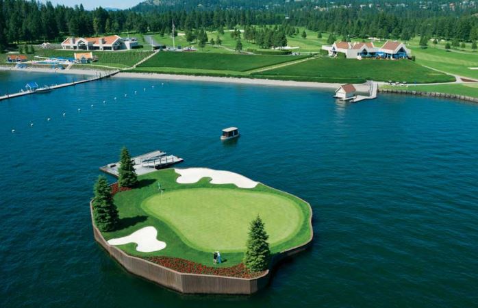 Island surrounded by lake with golf area