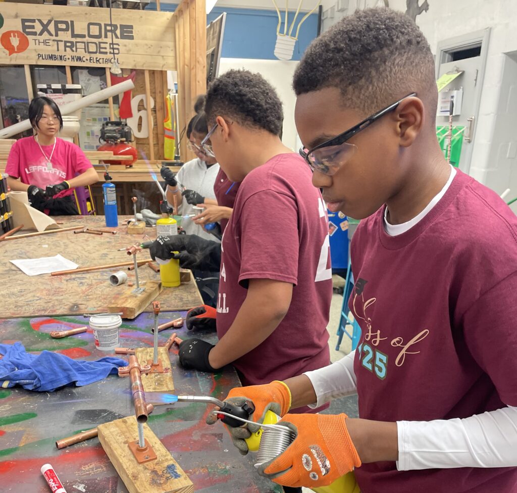 Kids working in the Explore the Trades Skills Lab.