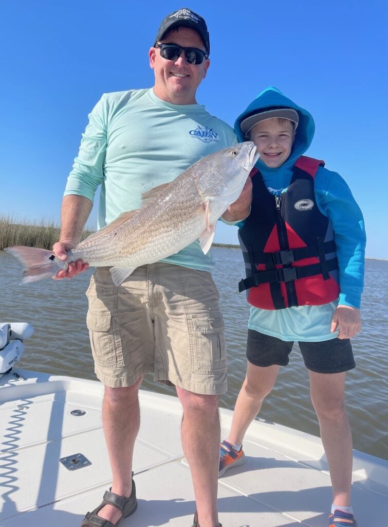 Man and child with fish