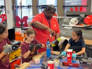 Three female students and a teacher
