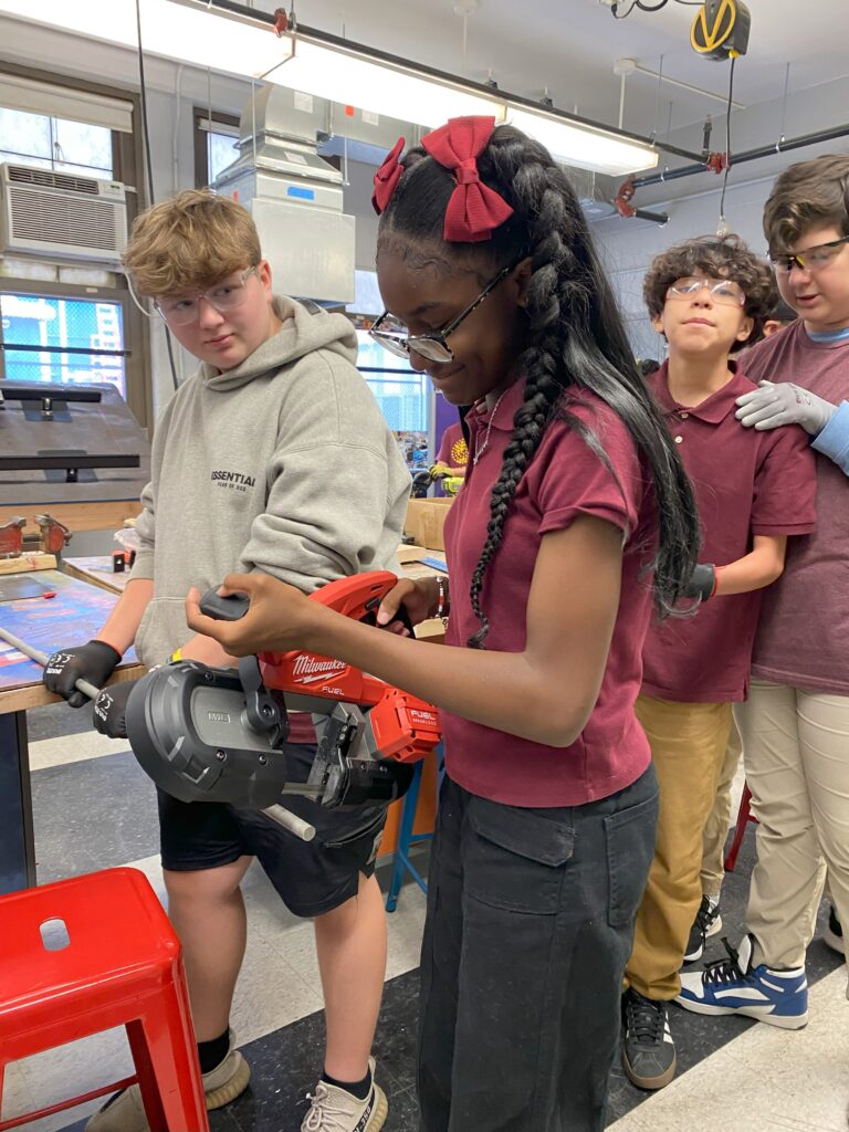 Female student with saw