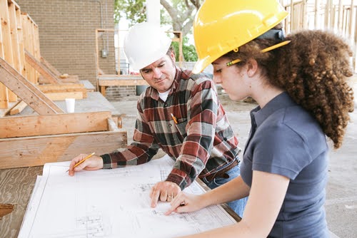 Student learning to read construction blueprints.