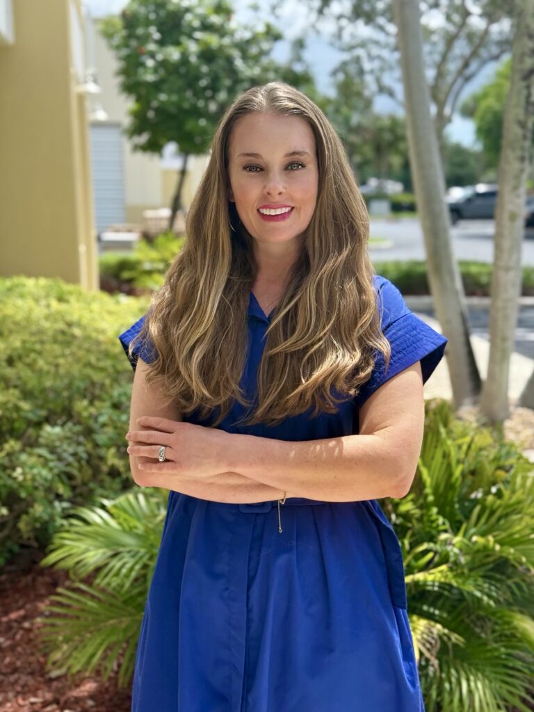 Woman smiling at the camera.