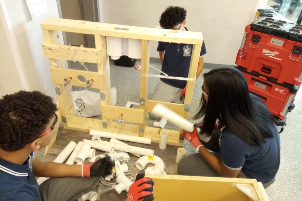 Students working with pipes