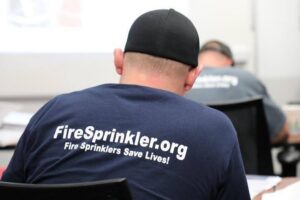 A fire sprinkler apprentice going through training.