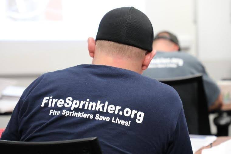 A fire sprinkler apprentice going through training.