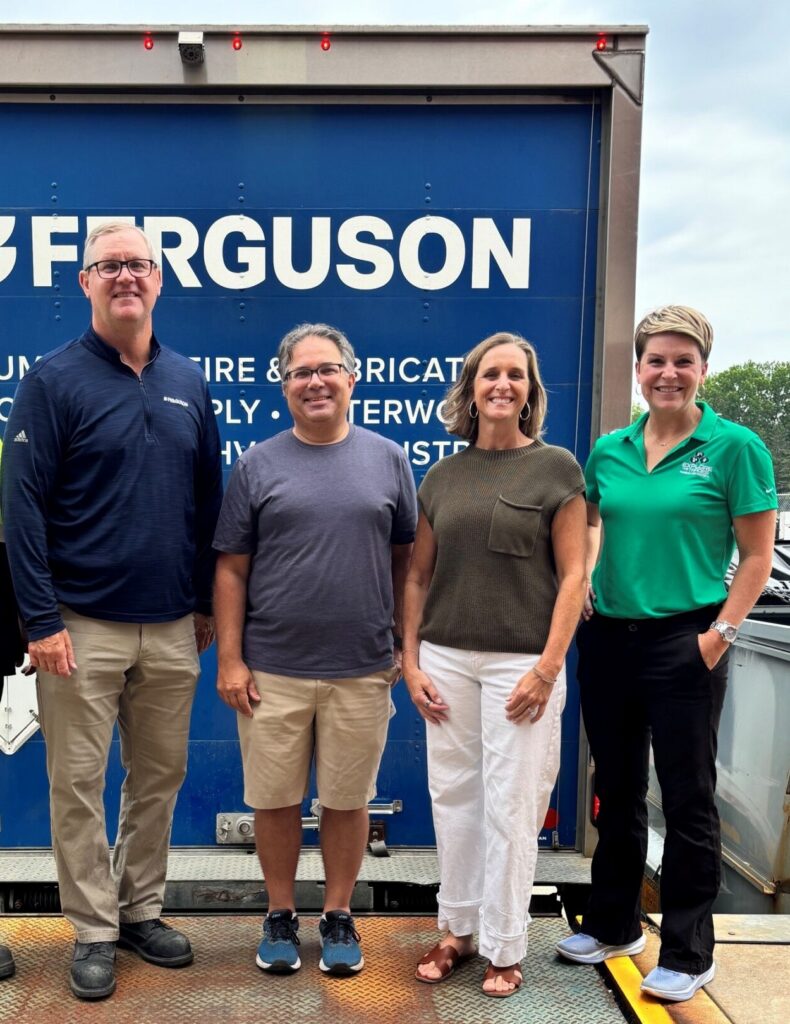 Explore The Trades and Ferguson representatives standing in front of a Ferguson truck